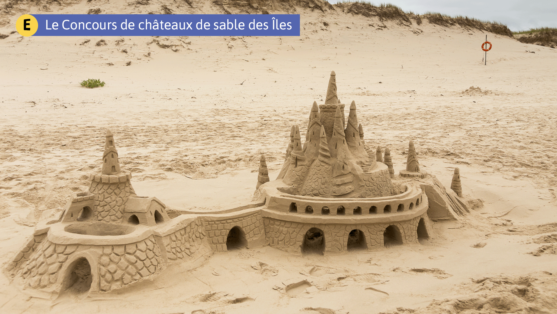E. Le Concours de châteaux de sable des Îles
